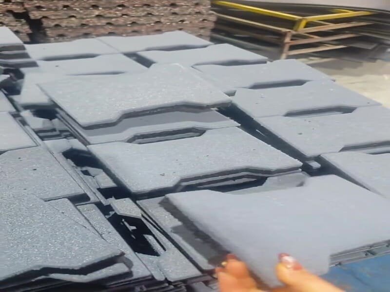 mechanic cutting rubber mat with soapy water